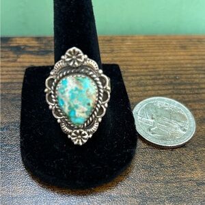 Beautiful turquoise and sterling stamped adjustable ring. NWOT